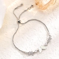 Detail of silver butterfly bracelet with adjustable bolo clasp and zircon accents - Silver Triple Butterfly Style
