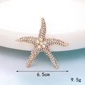 Detailed view of a gold starfish brooch with rhinestones measuring 6.5cm and weighing 9.5g - D327 Large Starfish