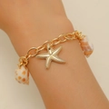 Golden starfish and shell charm bracelet for women with nautical beach vacation style - Starfish Shell Pendant Bracelet (DZ064) / KC Gold