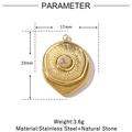 Macro detail of 17mm gold stainless steel sunburst pendant with natural stone inlay - Round Sunburst - Black Stone (VG828)