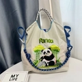 Detail of panda embroidery on cream nylon tote bag with braided blue and white strap - Blue-gray Panda - New (Without Shoulder Strap)