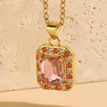Square pink zircon necklace with gold chain and colorful accent stones on mineral rock - Pink Zirconia