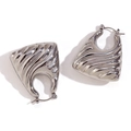 Modern silver irregular wavy hoop earrings with high-gloss metallic finish on white background - Silver