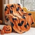Close-up of orange Halloween flannel blanket with black cat and bat prints on a sofa - Halloween Orange Print / 75*100cm