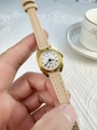 Close-up of elegant small dial women's quartz watch with beige strap and golden case - Apricot Strap