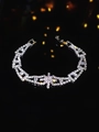 Elegant silver-toned tennis bracelet with sparkling zircon stones and floral centerpiece - Silver Cross Floral