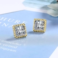 Square cut zircon stud earrings with golden beaded border on light blue background - Gold