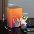 Astronaut figure sitting on moon with victory sign and orange gradient gift box - Small Gold-edged Model C (Color Box)