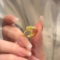 Gold plated dragon-scale open ring with a small pendant shown on a model hand - Gold Dragon Scale Pendant