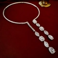 Detailed close-up of a silver rhinestone choker with teardrop fringe on red velvet - Silver Rhinestone Zircon Choker