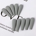 Detail of matte grey coffin press-on nails with long trapezoid shape on white backdrop - Rock Grey