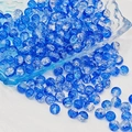 Close-up of blue crackle glass beads spilling from a glass bowl for DIY jewelry making - 8mm / Dark Blue