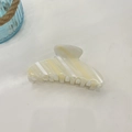 Macro shot of large acetate shark hair clip with cream yellow and white marble stripes - 10.5cm / Off-White Cream Silver Stripe