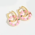 Macro detail of pink enamel hoop earrings with colorful zircon stones on gold base - Pink Hoop