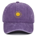 Close-up of yellow sun embroidery on a vintage washed purple cotton baseball cap - Purple