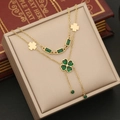Macro detail of double-layer gold necklace with emerald green heart clover pendants - 1# Necklace