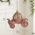 Pink glitter pumpkin carriage Christmas ornament hanging on a festive tree branch - Pumpkin Carriage