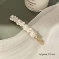Elegant 9cm gold alloy hair clip with varied white pearls on a light green tray - Pearl Flower (3932-2)