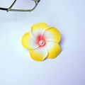 White and yellow plumeria flower hair clip with a pink pearl center on white backdrop - Orange-centered Floral Design With Yellow Trim And Pearls [4cm]