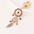 Portachiavi acchiappasogni dorato bohémien con strass colorati e ciondolo a piuma - Multicolore