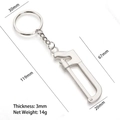 Mini silver alloy handsaw keychain pendant with precise dimensions and weight detail - Zigzag