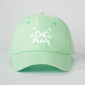 Close-up of Cat Mom embroidery and cat ears design on mint green cotton baseball cap - Light Green