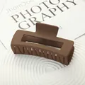 Large matte coffee brown square hair claw clip for thick hair shown on a white plate - Dark Coffee