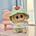 Green corduroy hat and plaid trousers outfit for Labubu doll sitting on pink surface - Green Plaid Bear Three-piece Set / First And Second Generation Keychains Are Compatible With La Cloth Dolls. Dolls Not Included.