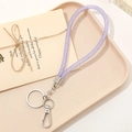 Detail of purple mesh glitter lanyard with metal keyring and clasp on a tray - Rhinestone Mesh Pendant (Clasp) / Purple