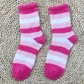 Pink and white striped coral fleece socks with ruffled cuffs on a woven mat background - One Size / Pink & White Thin Stripes