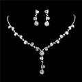 Macro detail of sunflower rhinestone necklace set with elegant flowing tassels - 483 Rhinestone 2-Piece Collection