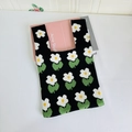 Detailed close-up of knitted floral tote bag showing daisy patterns and thick texture - Small Floral Black