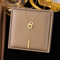 Minimalist gold necklace with interlocking square pendants in a brown jewelry gift box - Interlocking (AH186) / Gold