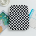 Black and white checkerboard iPad sleeve with zipper pocket in a minimalist desk setup - Black & White Checkerboard / 11"
