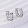 Detailed side view of silver hoop earrings with pave-set cubic zirconia on white stand - 5-Stone Row / Silver