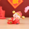 Cute God of Wealth miniature holding a red fortune bag with gold ingots for decor - Caishen Money Bag