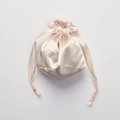 Pink satin drawstring pouch with silky texture and ribbon closure for eye mask storage - Nude Pink