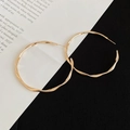 Minimalist twisted gold geometric hoop earrings with polished wavy texture for women - 5cm / Gold