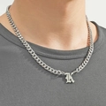 Silver Cuban link necklace featuring a Gothic letter K pendant on a male model - Silver Letter K