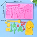 Macro view of pink silicone mold with gnome and tree shapes for Christmas DIY crafts - Gnome Holiday Theme (L#)