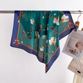 Detail of green floral silk scarf with white flowers and navy blue border on a hanger - 70x70cm / Navy Blue Border (FJ994-4)