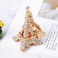 Portachiavi Torre Eiffel dorato con strass su un libro aperto, elegante fascino in metallo - Torre Eiffel Bianco