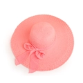 Detailed top view of pink wide brim straw sun hat with ribbon bow showing fine weave texture - Pink