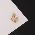 Macro detail of gold-plated teardrop connector with zircon stones for jewelry making - Light Blue