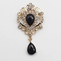 Vintage golden crystal brooch featuring black water-drop rhinestones and dangling pendant - Black