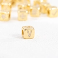 Close-up of 18k gold plated cube bead with zircon stones forming the letter V - V (Single Pendant)