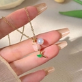 Elegant gold necklace featuring a tulip pendant with a pink petal and white pearl accent - NL1284-Tulip Pearl Necklace