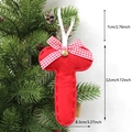 Red felt Christmas tree ornament with plaid bow and bell hanging on pine branch - T-Bell
