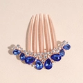 Detail of vintage golden hair comb featuring blue teardrop rhinestones and clear crystals - Gold Blue Large Small Teardrop Comb