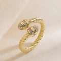 Luxurious 18K gold plated cable ring with zircon accents on a textured background - Adjustable Open / Gold Zirconia Twisted Rope Style (14391)